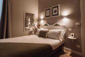 Postel nebo postele na pokoji v ubytování Rooms Genova dei Rolli
