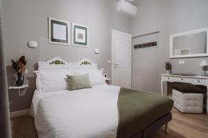 Postel nebo postele na pokoji v ubytování Rooms Genova dei Rolli