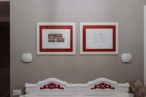 Postel nebo postele na pokoji v ubytování Rooms Genova dei Rolli