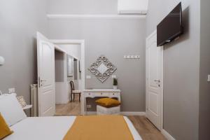 Postel nebo postele na pokoji v ubytování Rooms Genova dei Rolli