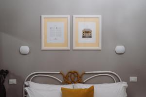 Postel nebo postele na pokoji v ubytování Rooms Genova dei Rolli