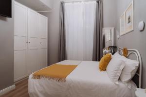 Postel nebo postele na pokoji v ubytování Rooms Genova dei Rolli