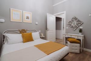 Postel nebo postele na pokoji v ubytování Rooms Genova dei Rolli
