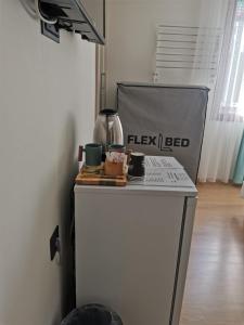 a kitchen with a table with cups on it at SIĞACIK SEN KONUK EVİ in Seferihisar