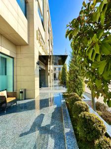 a lobby of a hotel with a building at Frankfort Hotel and Spa in Tashkent