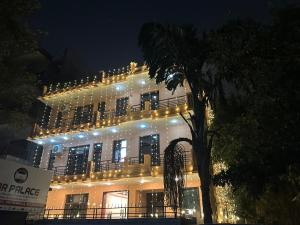 a lit up building with lights on it at night at entire house 17 rooms best for marriage/gatherings functions in Gurgaon