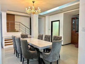 a dining room with a table and chairs at entire house 17 rooms best for marriage/gatherings functions in Gurgaon