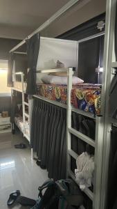 a room with bunk beds in a room at W District hostel in Bangkok