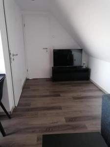 TV a/nebo společenská místnost v ubytování Ferienwohnung Mühlenblick