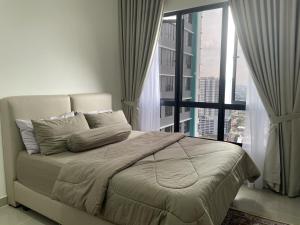 Tempat tidur dalam kamar di Shiro Res. MKH Boulevard II