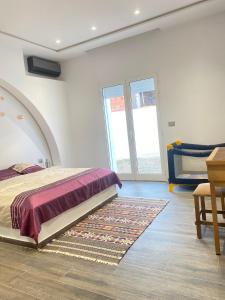 Postel nebo postele na pokoji v ubytování Dar Lili Djerba + 17 fotografií