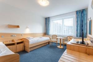 Postel nebo postele na pokoji v ubytování Complex Curie + 31 fotografií