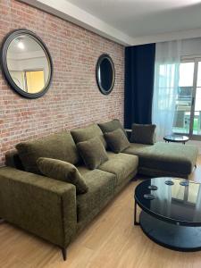 a living room with a couch and a mirror at Luxury House - Puerto Rico in Puerto Rico de Gran Canaria