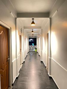 a corridor of a hallway with a long hallway at Lamin Guest House in Dawki