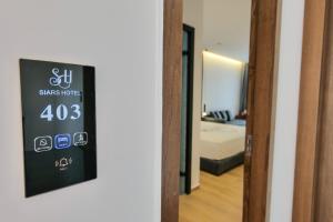 Postel nebo postele na pokoji v ubytování Hotel Siars