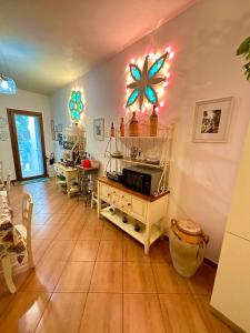 a living room with a table with a star on the wall at Dimora del Casale in Brindisi