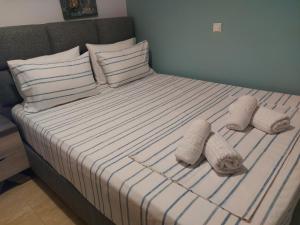 Postel nebo postele na pokoji v ubytování Aktaion Apartments