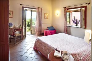 Кровать или кровати в номере Agriturismo Tenuta San Michele +89 фотографий