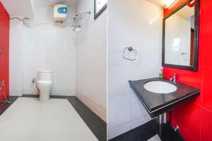 a bathroom with a sink and a toilet at FabHotel Rahul Palace in Nagpur
