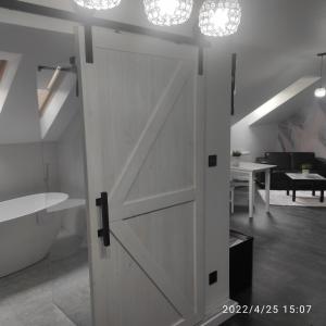 a white door in a room with a living room at Harmonica PREMIUM in Nowy Sącz +117 photos
