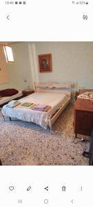 a bedroom with a bed and a table at Al casale in Capriglia