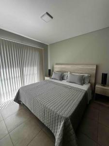 Ein Bett oder Betten in einem Zimmer der Unterkunft Departamento nuevo para 2 personas c/cochera