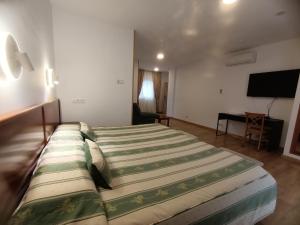 a bedroom with a large bed in a room at La Luna Blanca in Torremolinos