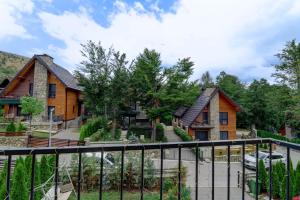 a house with a fence in front of it at Captivating 3-Bed Villa in Brezovica Ski Centre in Brezovica