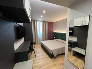 Postel nebo postele na pokoji v ubytování Hotel & Residence Castelli