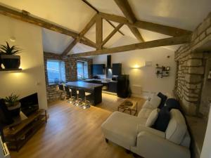 a living room with a white couch and a table at Robins Mill in Rishworth