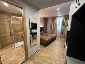 Postel nebo postele na pokoji v ubytování Hotel & Residence Castelli