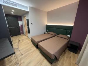 Postel nebo postele na pokoji v ubytování Hotel & Residence Castelli