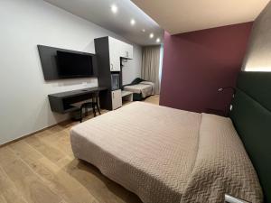 Postel nebo postele na pokoji v ubytování Hotel & Residence Castelli