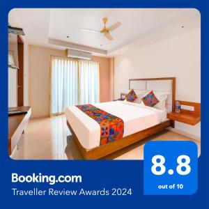 a hotel room with a bed in a room at FabHotel Phoenix Brookfield - Nr Kundalahalli Main Road in Bengaluru