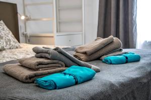 a pile of towels on top of a bed at Villa Blue Lagoon Moraira in Moraira +22 photos