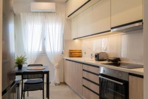 Kuchyň nebo kuchyňský kout v ubytování Pananos Sq. House II + 7 fotografií