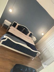 a bedroom with a large bed with two pillows at Visage appointment in Strumica