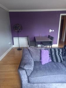 a living room with a couch and a table at 360 Dun Aoibhinn in Dungarvan