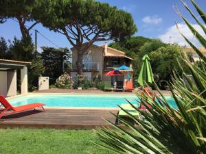 a villa with a swimming pool and a house at Bas de Villa T3 55m2 piscine in Six-Fours-les-Plages