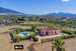 an aerial view of a house with a swimming pool at Cubo's Casa El Jazmin High Privacy in Alhaurín el Grande