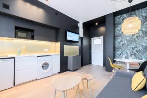 a kitchen and living room with a table and chairs at Marcq-en-Baroeul - beautiful fully equipped ! 2p in Marquette-lès-Lille