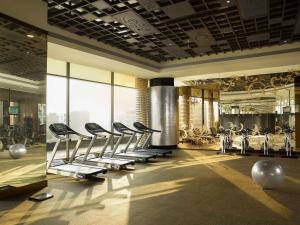 a gym with a row of chairs in a room at Sofitel Mumbai BKC in Mumbai