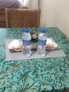 two bottles of water sitting on top of a table at Seaview beach Corus Paradise pd in Port Dickson