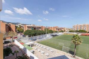 a tennis court in a city with a soccer field at 797 Holiday Rentals - Luminoso piso para 4 en Arroyo de la miel in Arroyo de la Miel