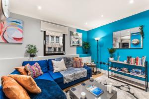 a blue living room with a blue couch at Few remaining days available for April - book now in Bristol