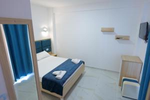 Postel nebo postele na pokoji v ubytování Hotel Vathi