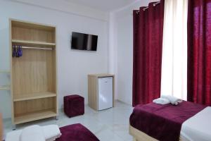 Postel nebo postele na pokoji v ubytování Hotel Vathi