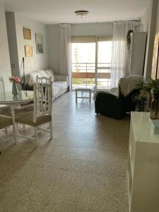 a living room with a couch and a table at Bahia de Algeciras in Algeciras