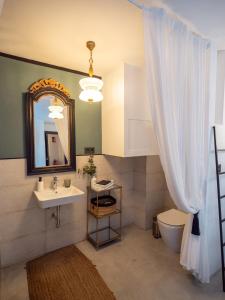 a bathroom with a sink and a mirror at Finca Casabela in Pinos del Valle