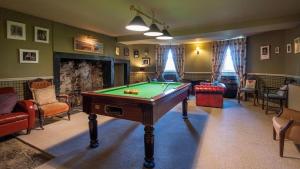 a living room with a pool table in it at Durn House in Portsoy